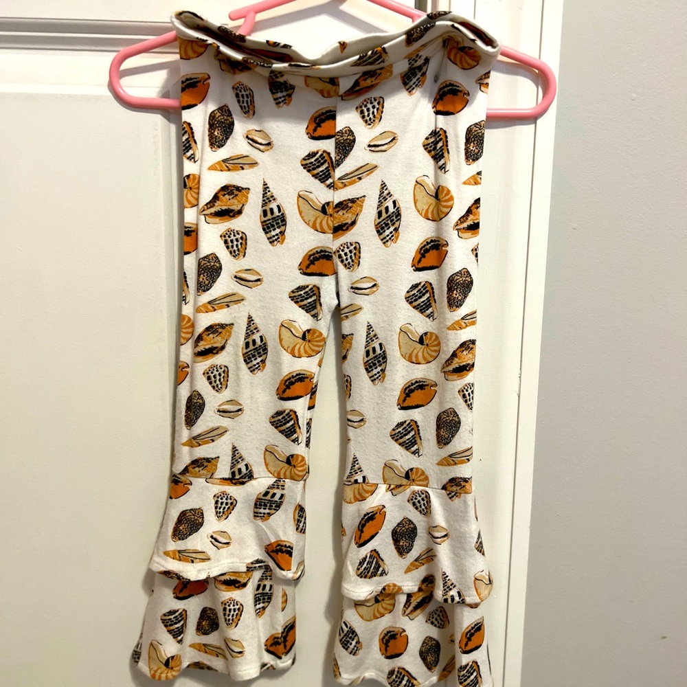 Kate Quinn 18-24 seashell pants fits like 12-18 for us. We wore at 12 months.